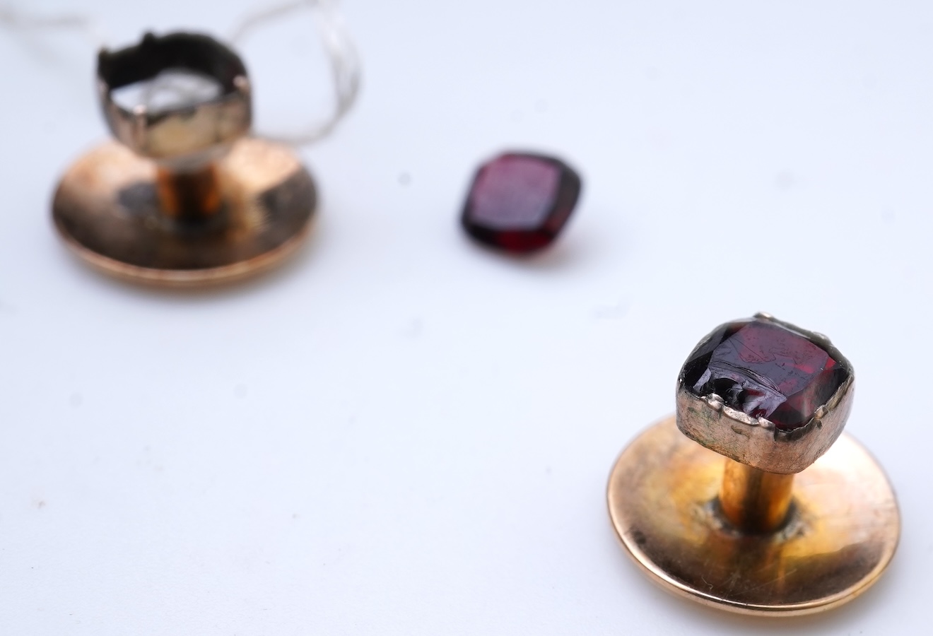 A collection of cufflinks and dress studs